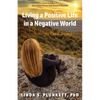 Living a Positive Life in a Negative World: My Uphill Journey - Paperback